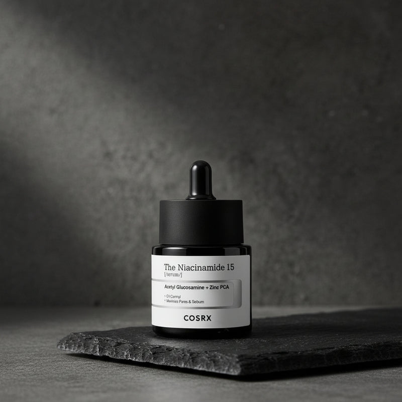 Cosrx skincare serum bottle with dropper on a dark background